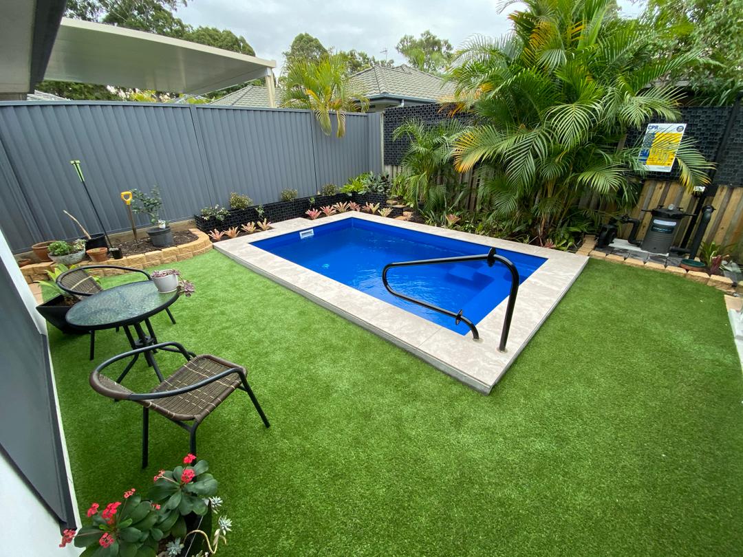 Compact fibreglass plunge pool in a small courtyard
